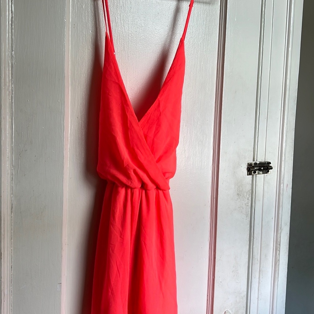 Orange one piece romper available. Breathable material; perfect summer wear